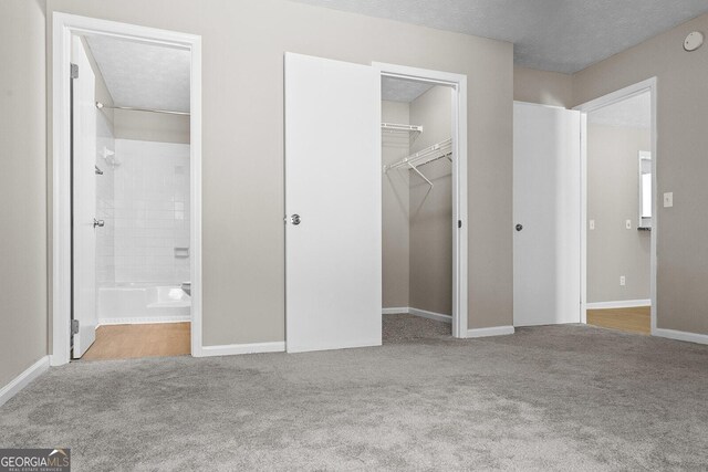 bathroom featuring toilet, vanity, a textured ceiling, and hardwood / wood-style floors