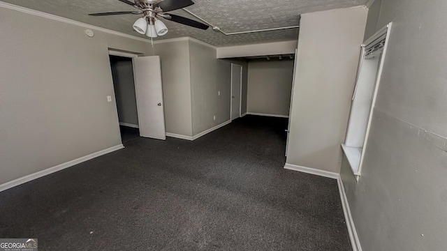 spare room with a textured ceiling, ceiling fan, and crown molding