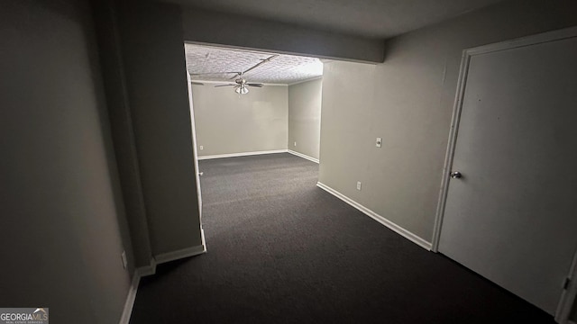 hallway with carpet floors