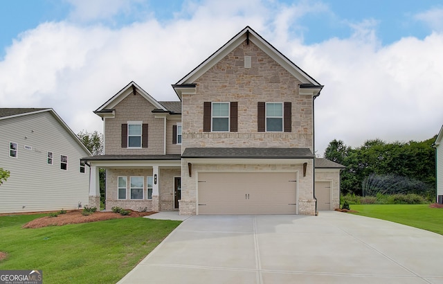 craftsman house with a front yard and a garage