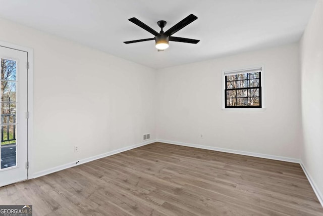 unfurnished room featuring light wood-type flooring and ceiling fan