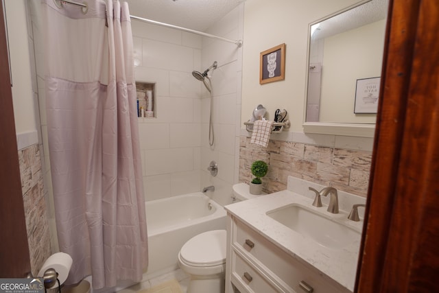 full bathroom with toilet, shower / bath combo, vanity, and a textured ceiling