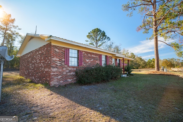 view of home's exterior featuring a yard