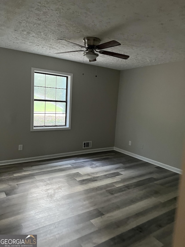 unfurnished room featuring a textured ceiling, ceiling fan, and wood-type flooring