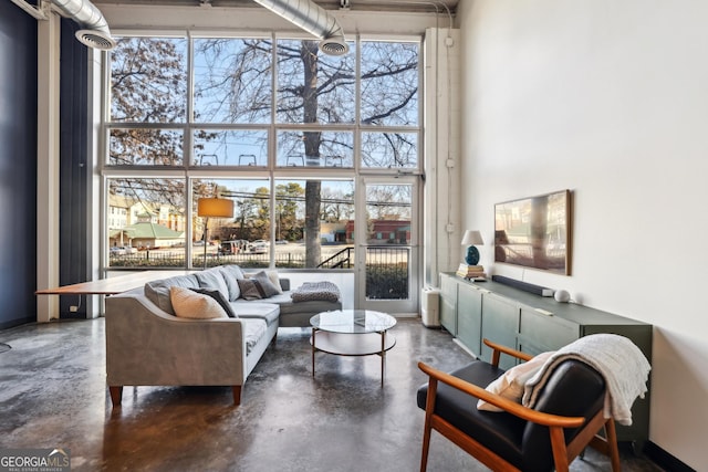 living room with a high ceiling