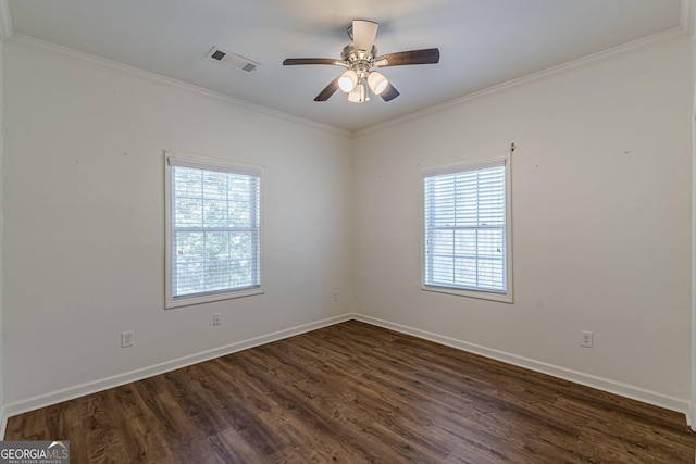 spare room with dark hardwood / wood-style flooring, ceiling fan, a healthy amount of sunlight, and crown molding