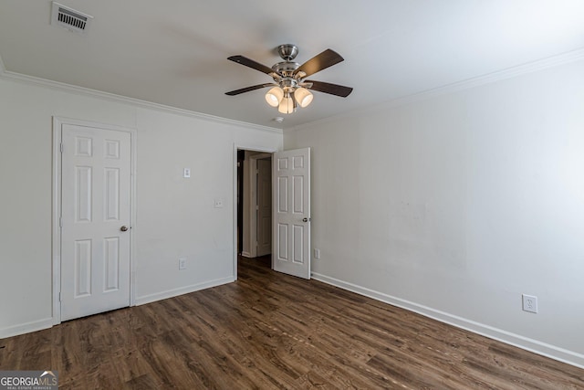 unfurnished room with dark wood-type flooring, ceiling fan, and crown molding