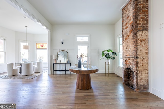 interior space with a fireplace and dark hardwood / wood-style floors