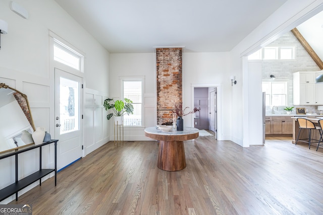 entryway with light wood-type flooring and sink