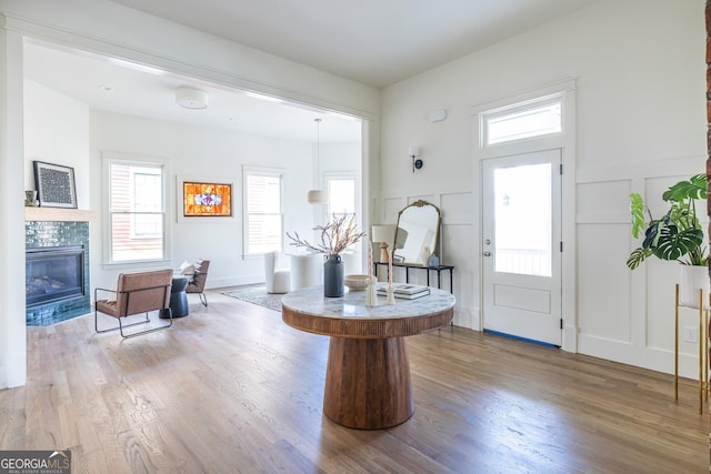 foyer with hardwood / wood-style flooring and a fireplace