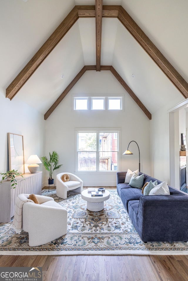 living room with lofted ceiling and hardwood / wood-style floors