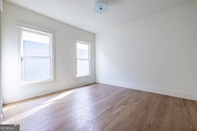 empty room with wood-type flooring