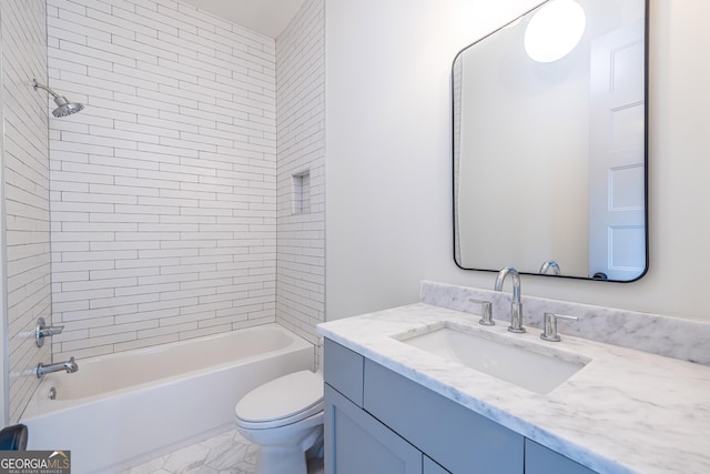 full bathroom with toilet, tiled shower / bath combo, and vanity