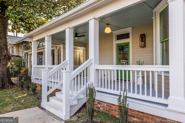 view of exterior entry featuring covered porch