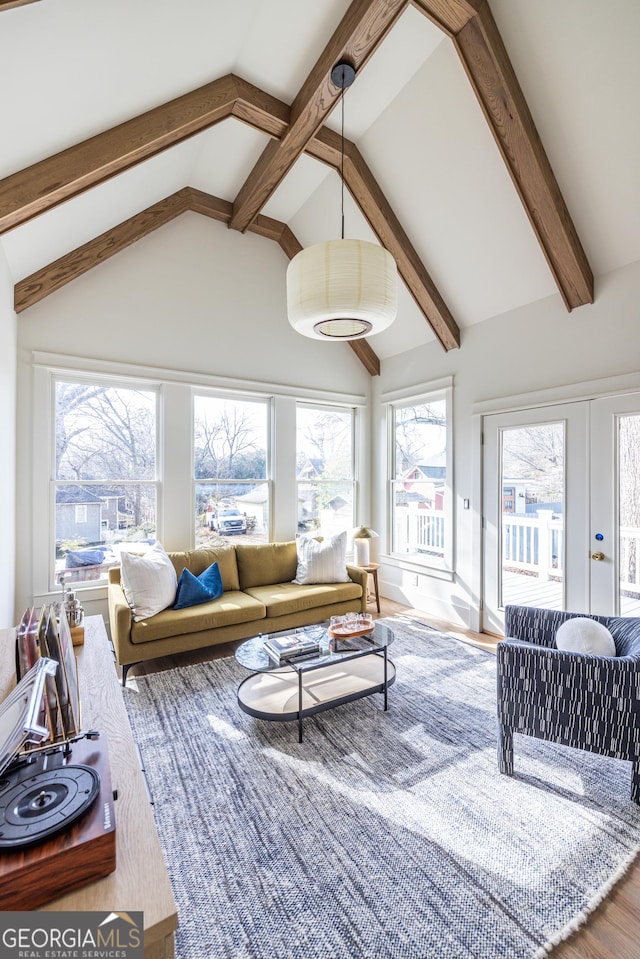 sunroom with french doors and vaulted ceiling with beams