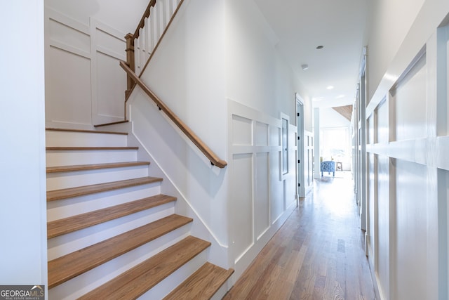 staircase featuring hardwood / wood-style floors