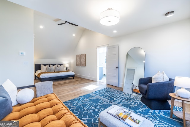 bedroom with hardwood / wood-style flooring and vaulted ceiling