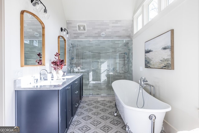 bathroom with separate shower and tub and vanity