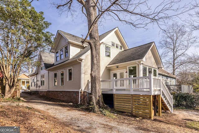 view of property exterior with a wooden deck