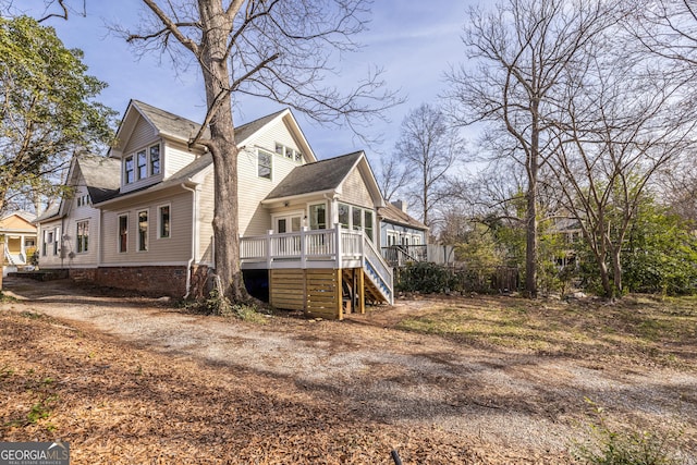 view of property exterior with a deck