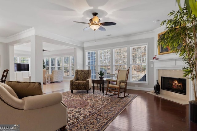 interior space with a high end fireplace and ceiling fan