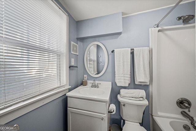 full bathroom with toilet, vanity, and  shower combination