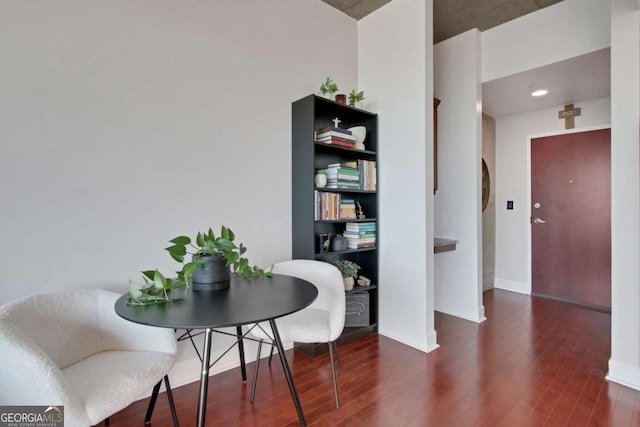 dining space featuring dark wood-type flooring