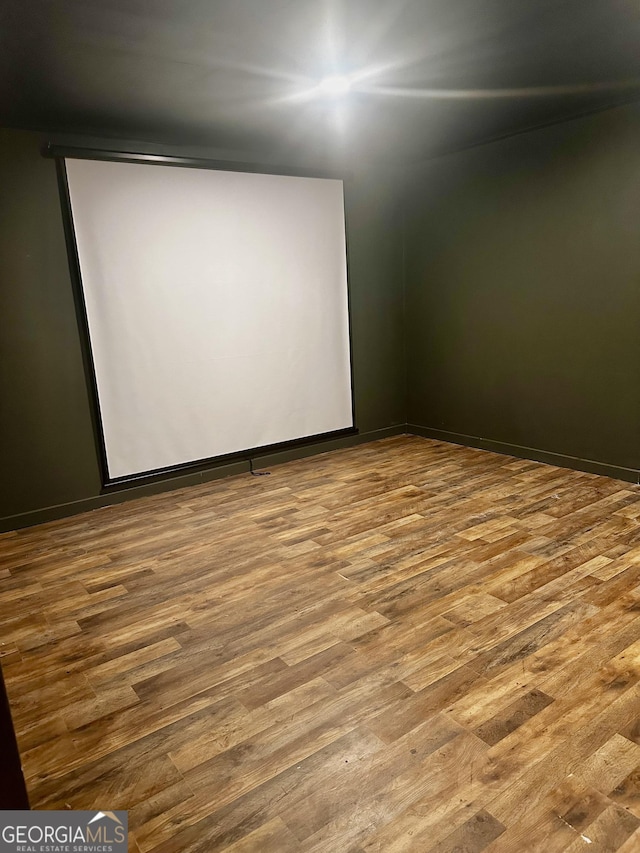 unfurnished room with hardwood / wood-style floors