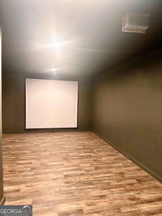 home theater with light hardwood / wood-style floors