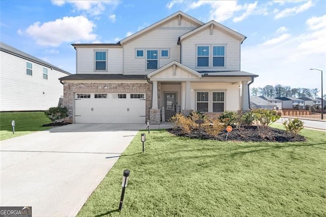 craftsman-style home featuring a front lawn and a garage