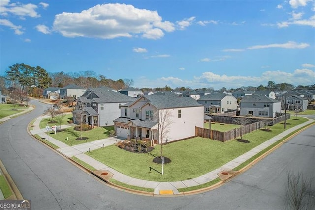 exterior space featuring a front lawn and a garage