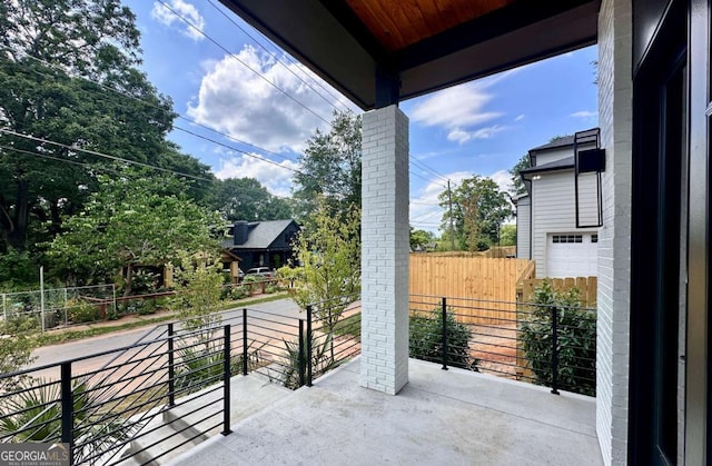 view of patio featuring a balcony