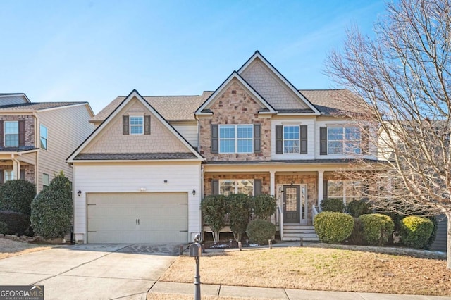 craftsman house featuring covered porch and a garage