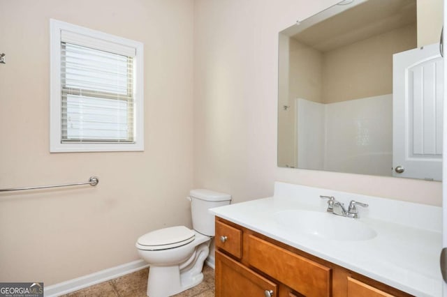 bathroom with tile patterned flooring, a shower, vanity, and toilet