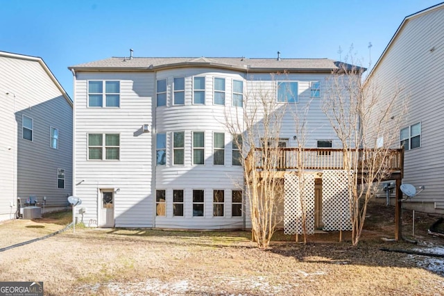 rear view of property featuring central AC