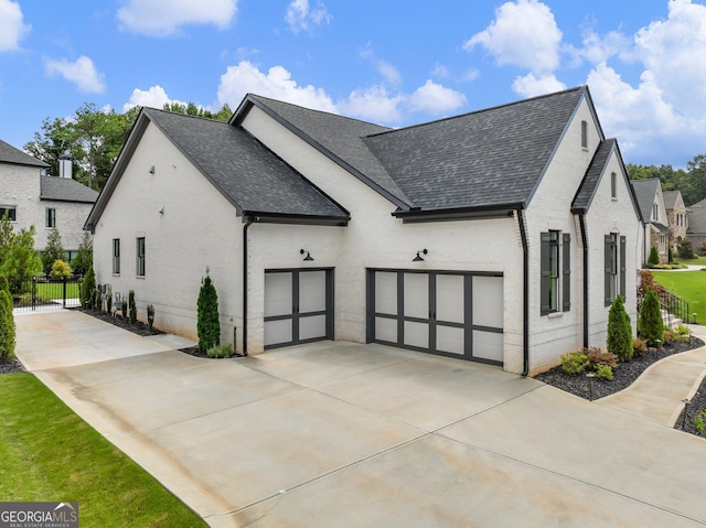 view of side of home featuring a garage