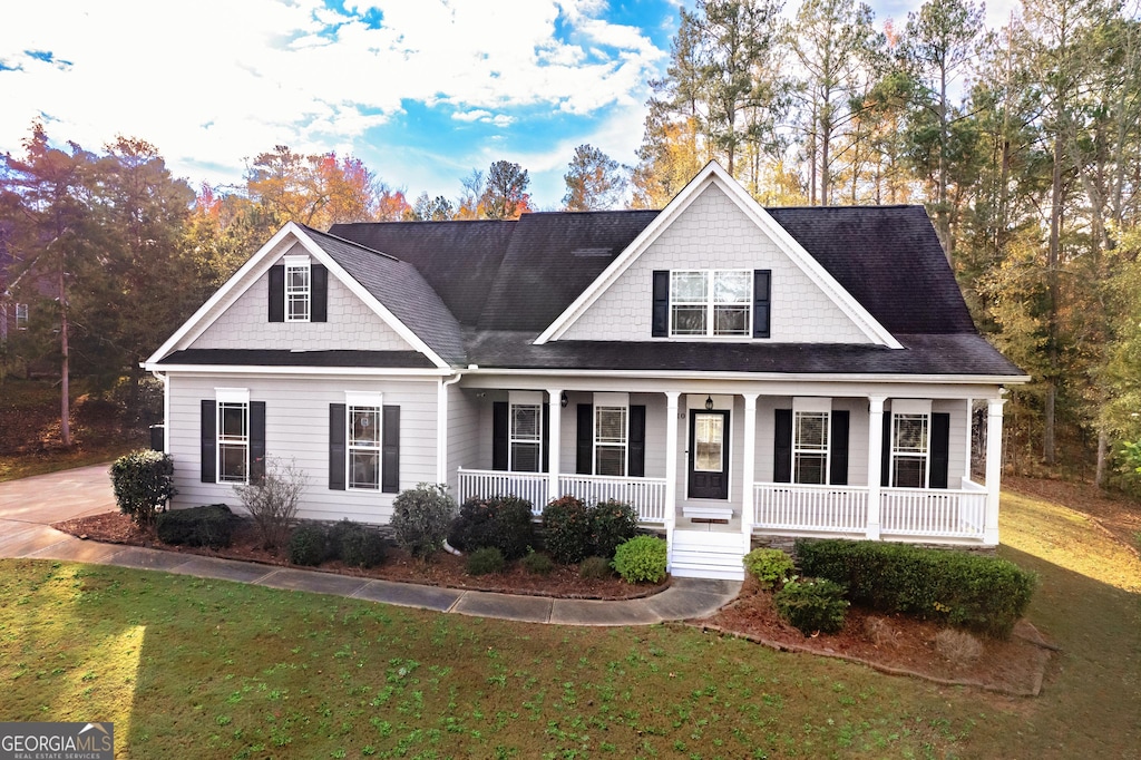 view of front facade with a porch and a front yard