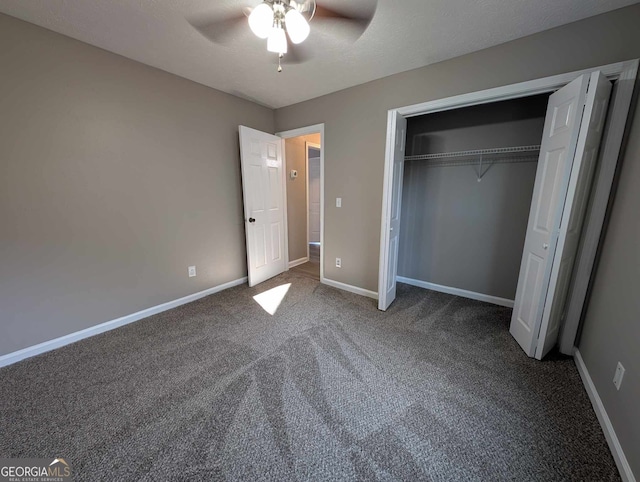 unfurnished bedroom featuring a textured ceiling, carpet floors, ceiling fan, and a closet