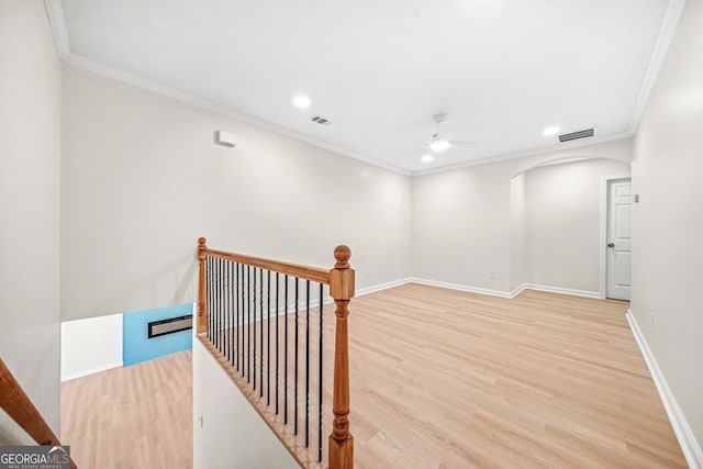 interior space with crown molding and wood-type flooring