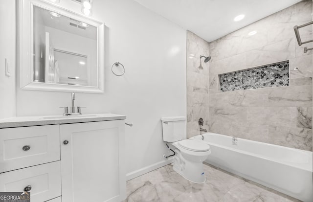 full bathroom with toilet, vanity, and tiled shower / bath combo