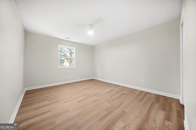 spare room featuring light wood-type flooring