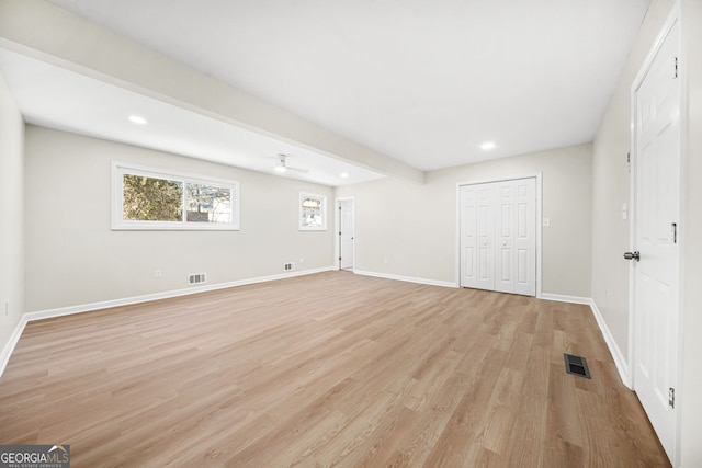 interior space with light wood-type flooring and ceiling fan