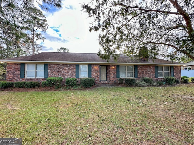 ranch-style house with a front yard