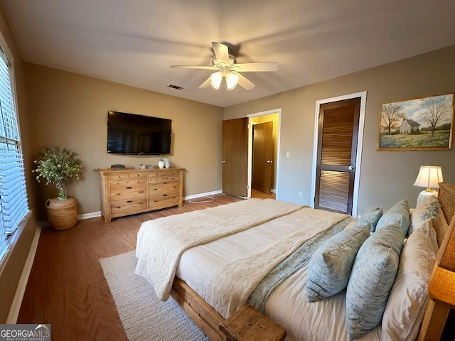 bedroom featuring ceiling fan and wood-type flooring