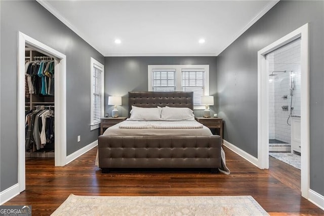 bedroom with a closet, connected bathroom, ornamental molding, and dark hardwood / wood-style floors