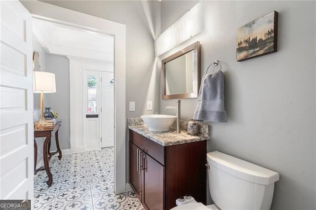 bathroom with toilet and vanity