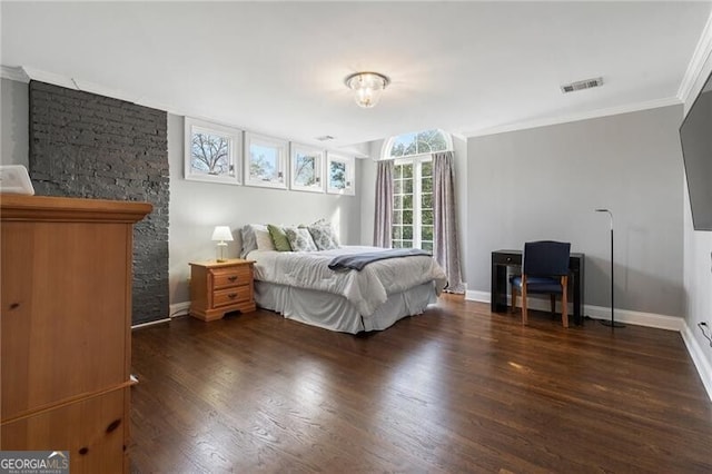 bedroom with ornamental molding and dark hardwood / wood-style floors