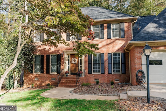 colonial house featuring a garage