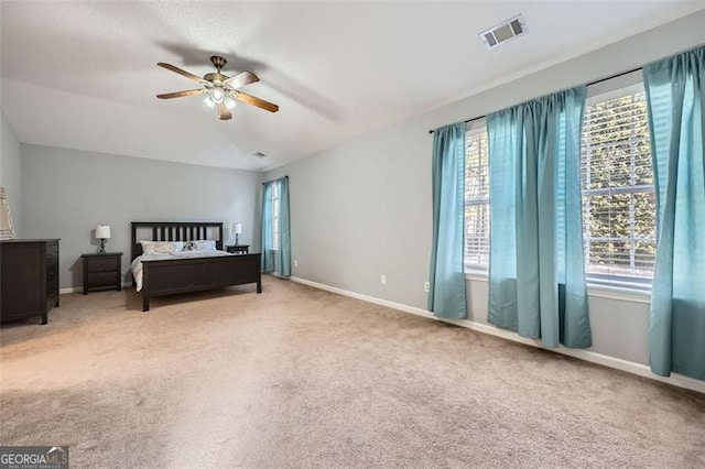 carpeted bedroom featuring lofted ceiling and ceiling fan