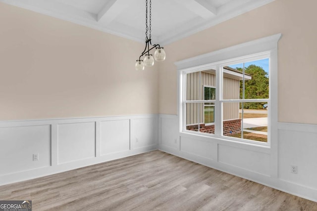 unfurnished dining area with beam ceiling, light hardwood / wood-style flooring, a notable chandelier, and coffered ceiling